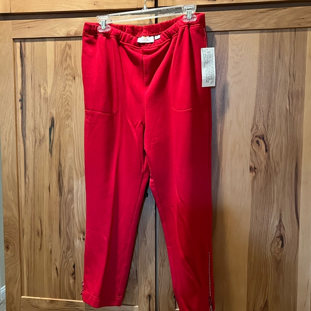 size medium, red, sweatpants, rhinestone side, zippers, and pockets